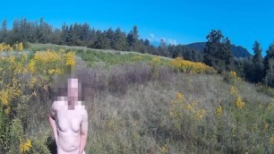 Naked guy masturbating in open field